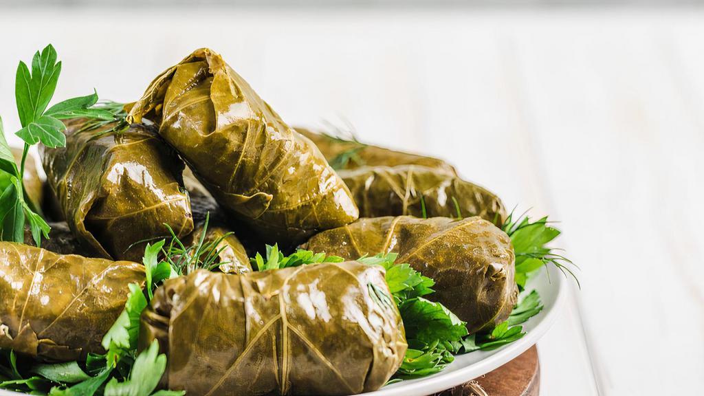 Grape Leaves · 8 pieces: all vegetarian stuffed grape leaves with rice and vegetables.