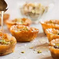 Mini Baklava · 6 delicious pieces of phyllo with chopped pistachios and honey.