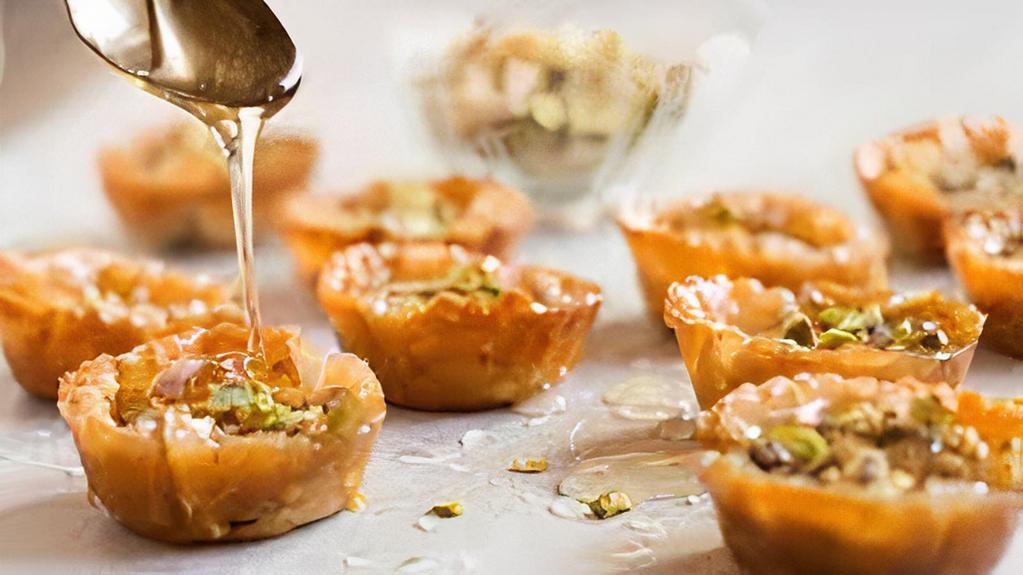 Mini Baklava · 6 delicious pieces of phyllo with chopped pistachios and honey.