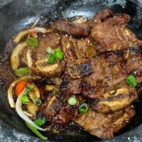 La 갈비구이 La Galbi Gui · Sweet garlic & onion soy sauce marinated grilled prime beef short ribs.