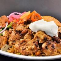 Chicken Shawarma Platter · Marinated chicken breast with rice, hummus, grilled onions and bell peppers, pickles, and a ...