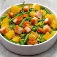 Crispy Chicken Salad · Crispy chicken breast*, kale, romaine, wonton strips, green beans, oranges, and lime-ginger ...