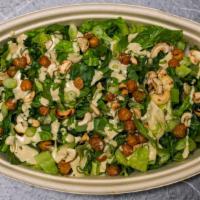Kale Cashew-Caesar Salad · Baby kale, toasted cashews, crispy chickpeas, scallions, and cashew Caesar dressing. Vegan, ...