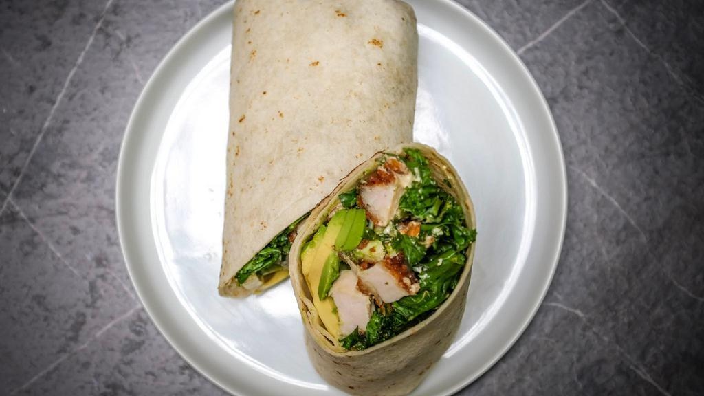 Crispy Chicken Caesar Wrap · Soy-free. Contains cashews. Crispy chicken breast, kale, romaine, avocado, toasted cashews, scallions, and cashew Caesar dressing in a ﬂour tortilla.