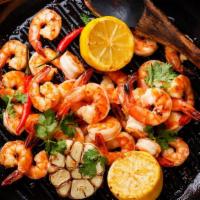 Chili Shrimp · Sizzling shrimp sautéed with onions and green peppers in hot chili sauce.