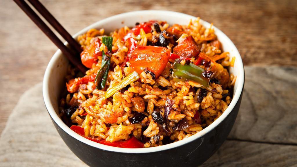 Chili Garlic Fried Rice · Sizzling traditional garlic flavored rice, served spicy.