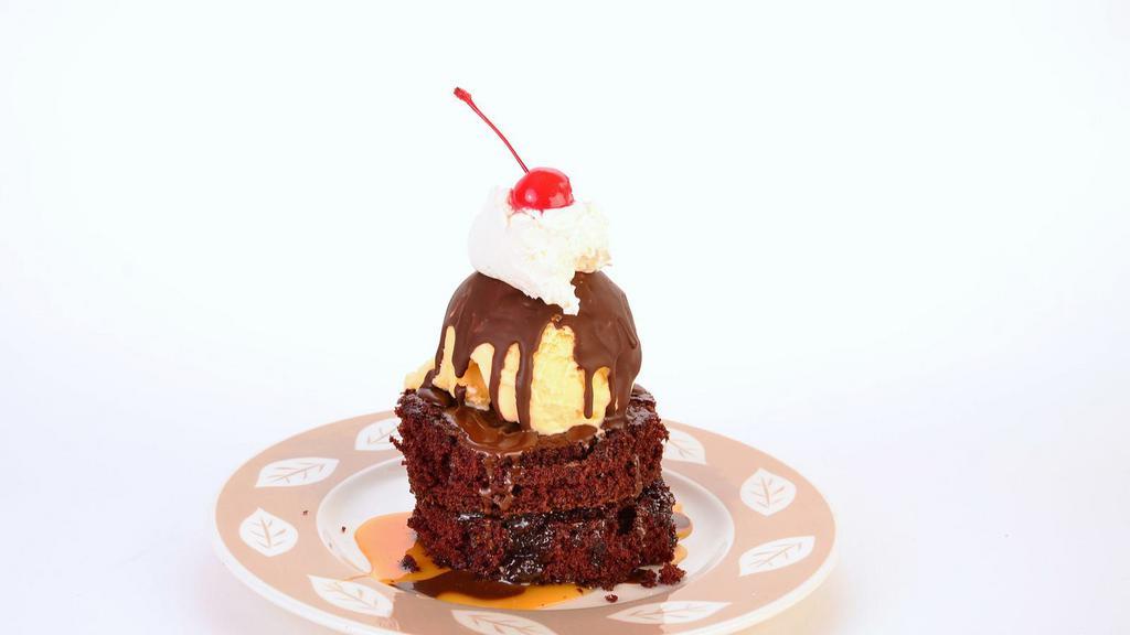 Hot Brownie Fudge With Ice Cream · Hot fudge brownie topped with vanilla ice cream.