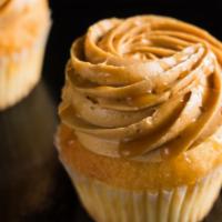 Dulce De Leche · Vanilla cake topped with caramel cream cheese frosting and caramel drizzle.