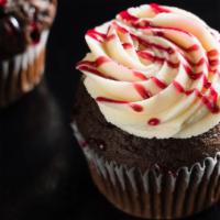 Chocolate Raspberry · Raspberry preserves filled chocolate cake topped with vanilla frosting and raspberry drizzle.
