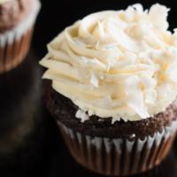Chocolate Coconut · Classic chocolate cake topped with coconut frosting and coconut flakes.