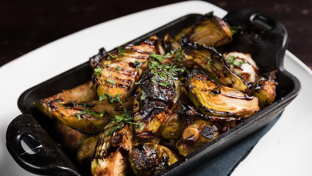 Charred Brussels Sprouts · Balsamic, pancetta, and pearl onion.