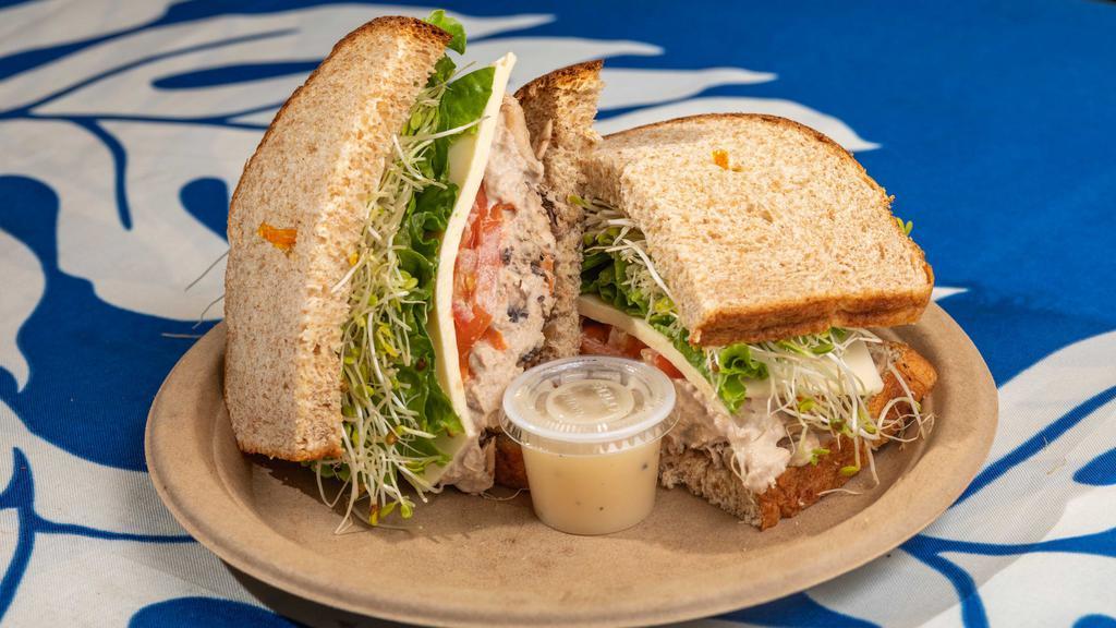 Tuna Melt · Popular. Mushrooms, tomatoes, melted cheese, carrots, lettuce, sprouts, papaya seed dressing.