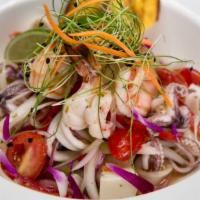 Ceviche Mixto · Fish, shrimp, calamari, scallop in lime with sweet peppers mango, onions and cilantro.