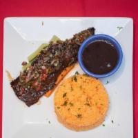 Churrasco · Grilled skirt steak with yucca crispy with traditional chimichurri sauce.