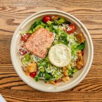 Salmon Caesar Salad  · Organic romaine, organic baby kale, cherry tomatoes, grilled sustainable salmon, garlic crou...