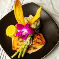 Salmon Carnadas · Twelve ounces grilled salmon stuffed with crab meat or shrimp grilled asparagus in a creamy ...