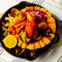 Mariscada Carnadas · Calabaza squash filled with lobster, mussels, clams, shrimp and calamari in a lobster enchil...