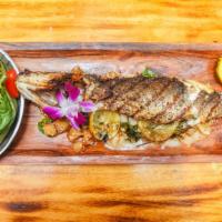 Branzino Carnada · Slow roasted 1.5 to two pounds of whole branzino in a lemon garlic sauce served with roasted...