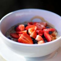 Oatmeal · with fresh seasonal berries, date honey and your choice of milk