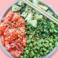 The Classic Poke Bowl · Sushi Grade Salmon, cilantro, edamame, cucumbers, sesame seeds, rice puffs, topped with ponz...