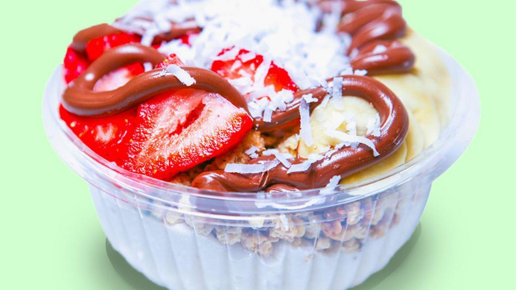 Coco Sweet Coconut Bowl · Our Famous Coconut Base topped with gluten free granola, banana, strawberry, coconut flakes, and Nutella. Vegetarian friendly 🌿