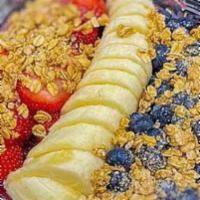 Almond Berry Bowl · Organic acai blended with banana, almond butter, almond milk, topped with banana, mango, pin...