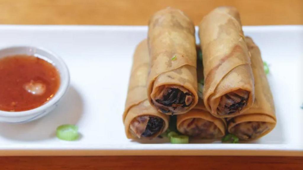 Vegetable Spring Roll` · Four pieces of vegetable spring roll.