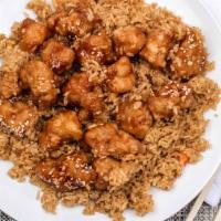Sesame Chicken · Served with fried rice and pork egg roll.
