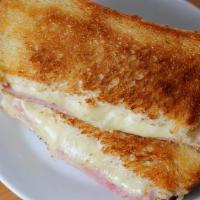 Grilled Ham Sandwich · Sliced Ham, Melted American Cheese, Lettuce, and Tomato.