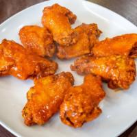 Buffalo Wings · Six pieces. Includes one sauce per order.