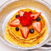 Berry Nut Pancakes · Three pancakes, loaded with blueberry and almonds.