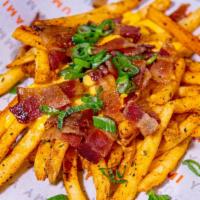 Manly Fries · Cheese sauce, bacon crumbles, and scallions served with your choice of one sauce.