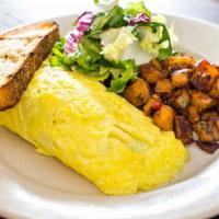 Omelettes · Served with mixed greens and herb-roasted potatoes.