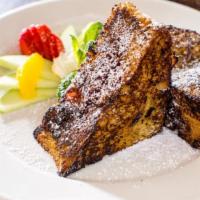 Dino French Toast · Thick-sliced pullman bread stuffed with raspberry jelly. Served with mixed fruit and maple s...