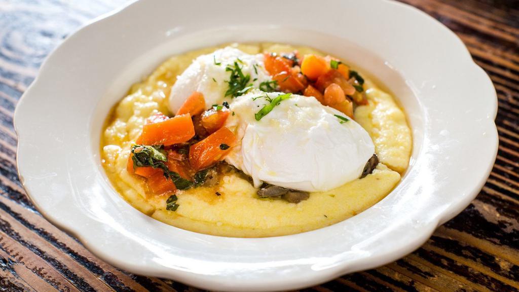 Eggs & Polenta · Poached eggs, tomatoes, and mushrooms over creamy parmesan polenta.
