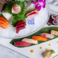 Sushi Sashimi Combo · 5 pieces of sushi, 9 pieces of sashimi and a tuna roll.