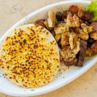 Arepa Con Todo / Arepa With Everything Platter · Arepa grande con queso, carne asada cortada, chicharronesm salchicha colombiana y pechuga de...