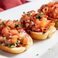 Bruschetta · Toasted baguettes topped with roma tomatoes, bermuda onions, basil, and garlic
