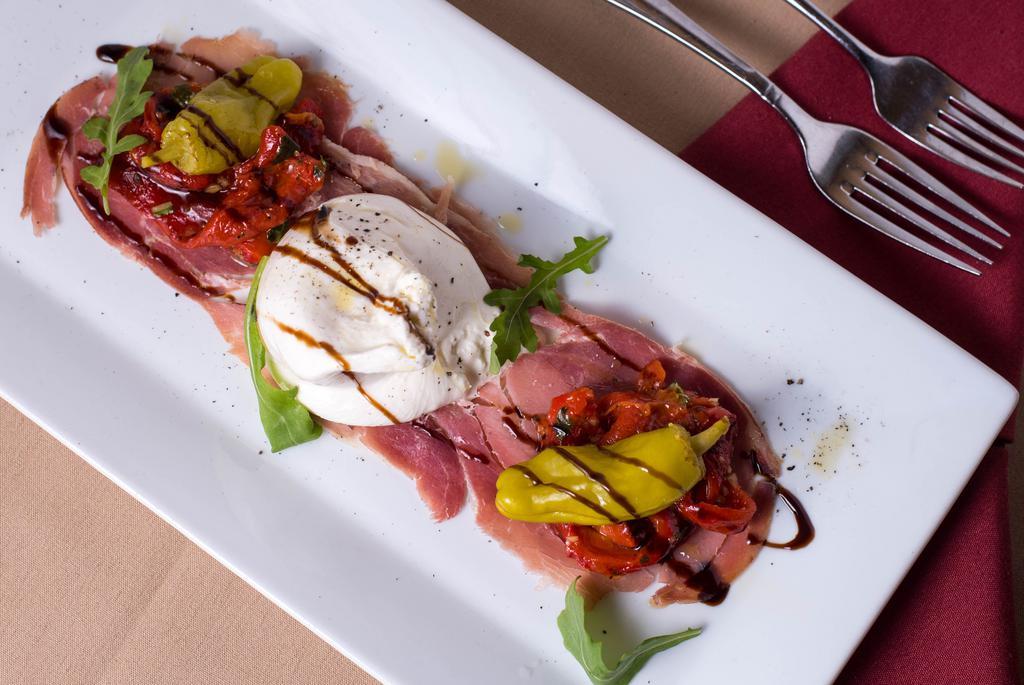 Antipasto · Burrata mozzarella and roasted red peppers over prosciutto topped with basil oil and a fig balsamic reduction