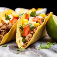 Ground Beef Tacos · Delectable tacos with ground beef, pico de gallo, roasted corn, satisfying black beans, ched...