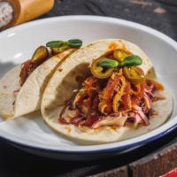 Pulled Pork Tacos · Perfectly made tacos with pulled pork, pico de gallo, roasted corn, black beans, creamy ched...