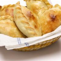 Guava & Cheese Empanadas · Flaky fried flour pastry filled with guava and cheese.