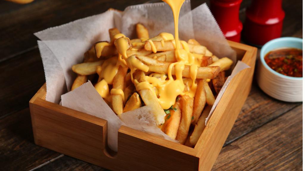 Cheese Fries · Golden brown, crispy french fries topped with our house made 6-cheese sauce.