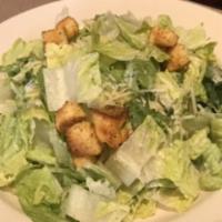 Large Caesar Salad · romaine lettuce tossed with parmesan cheese and croutons in a caesar salad dressing.