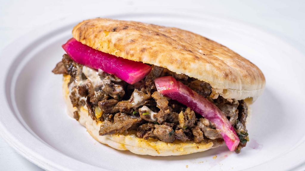 Beef & Lamb Shawarma Sandwich · Cooked Slowly on Stand Up Rotisserie.