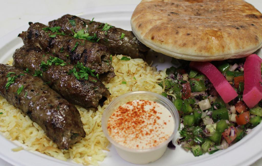 Kofta Kebab Platter · A delicious Blend of fresh beef, herbs and spices to make the perfect flavoring of kofta on a skewer. Served on a bed of Egyptian rice, side of Tahini and mum salad