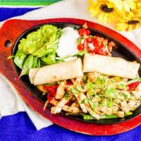 Fajita · Sauteed with onions, peppers and tomatoes served with Mexican rice and beans, flour tortilla...