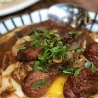 Creole Shrimp N' Sausage Grits · sautéed garlic shrimp, andouille sausage, bell peppers & onions, red eye gravy serve with tw...