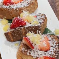 Brulee'D French Toast · Punaluu sweet bread, pineapple, shredded coconut, vanilla maple syrup