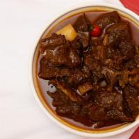 Goat Curry · Served with your choice of famous veggie fried rice or veggie chowmein
